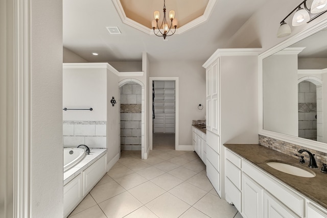 bathroom featuring vanity, tile patterned flooring, crown molding, and a notable chandelier