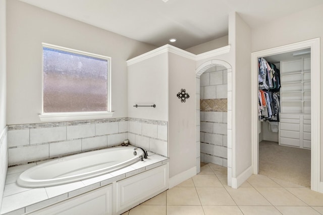 1240 Concho Trl, Prosper, TX 75078 - bathroom with a garden tub, a spacious closet, and tile patterned flooring