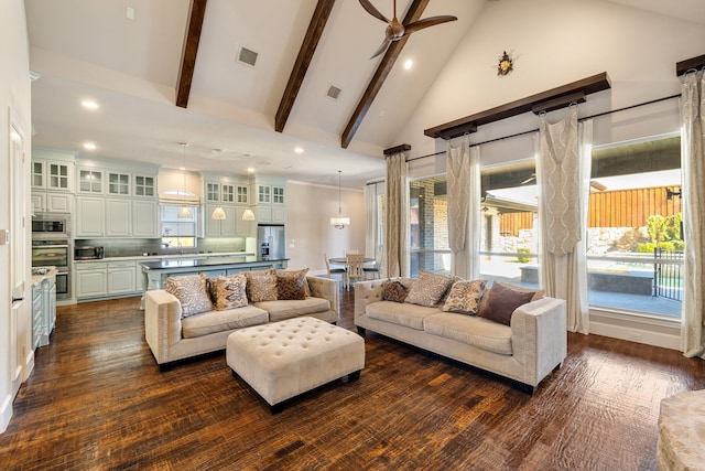 living room with high vaulted ceiling, dark hardwood / wood-style flooring, ceiling fan, and beam ceiling