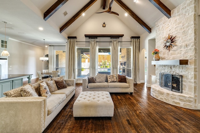 living room with dark wood-type flooring, a fireplace, beam ceiling, and high vaulted ceiling