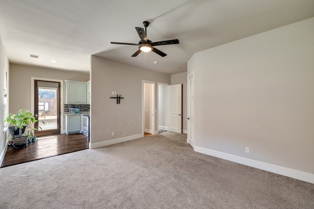 interior space with wood-type flooring and ceiling fan