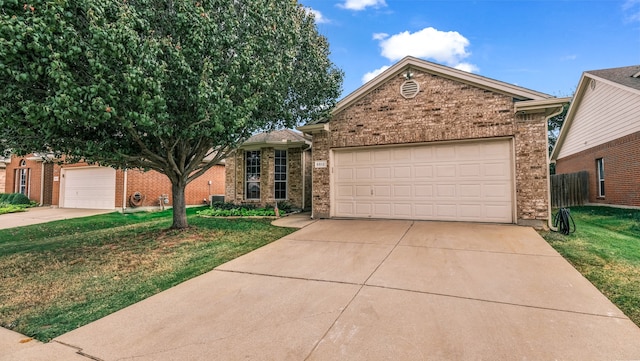 view of front of property featuring a front lawn and a garage