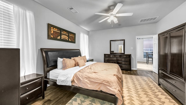 bedroom featuring ceiling fan and dark hardwood / wood-style flooring