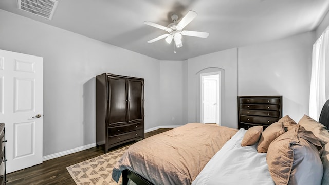 bedroom with ceiling fan and dark hardwood / wood-style flooring