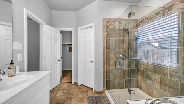 bathroom featuring vanity and an enclosed shower