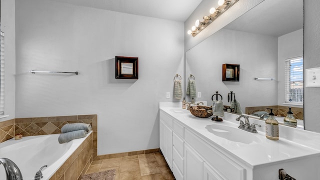 bathroom with vanity and a relaxing tiled tub