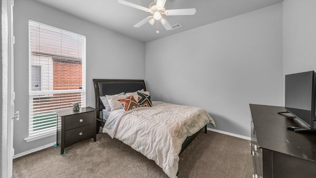 carpeted bedroom with ceiling fan