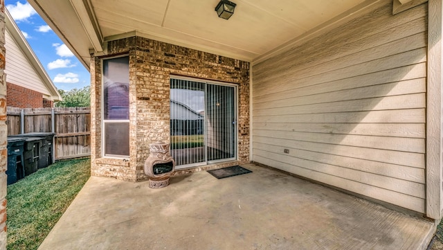 doorway to property with a patio