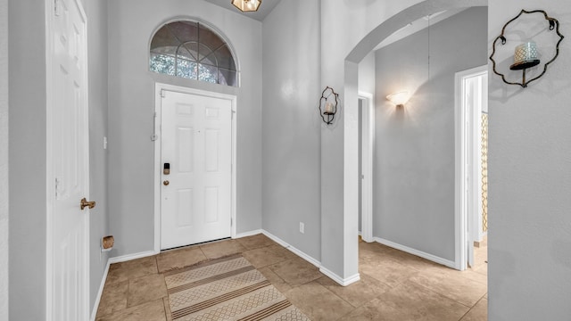 foyer with light tile patterned floors