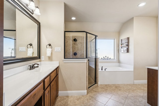 bathroom featuring vanity, shower with separate bathtub, and tile patterned flooring