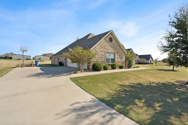 view of front facade featuring a garage and a front lawn