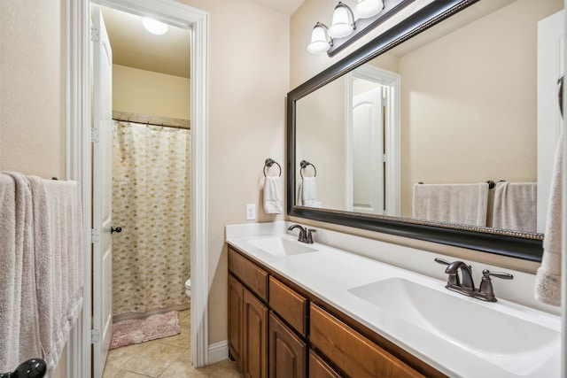 bathroom with toilet, vanity, a shower with shower curtain, and tile patterned flooring