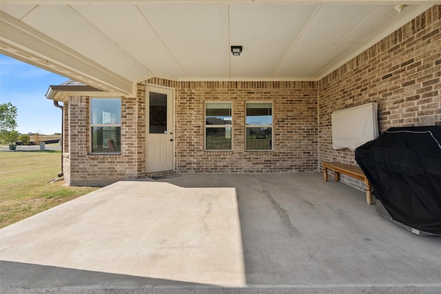 view of patio with a grill