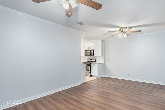 unfurnished living room with light wood-type flooring, ceiling fan, and ornamental molding