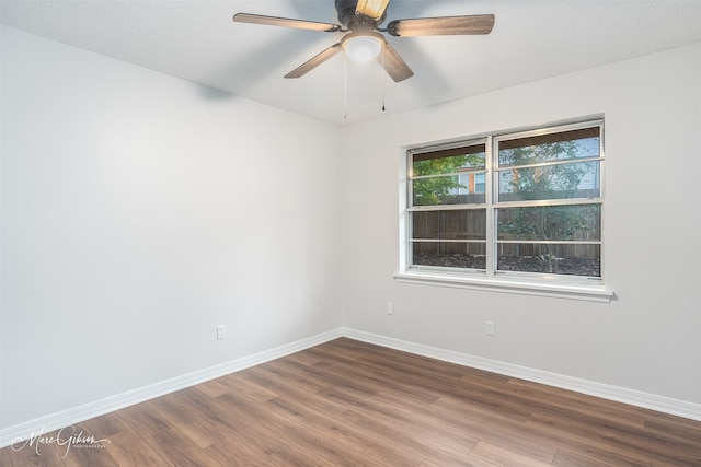 spare room featuring a textured ceiling, hardwood / wood-style flooring, and ceiling fan