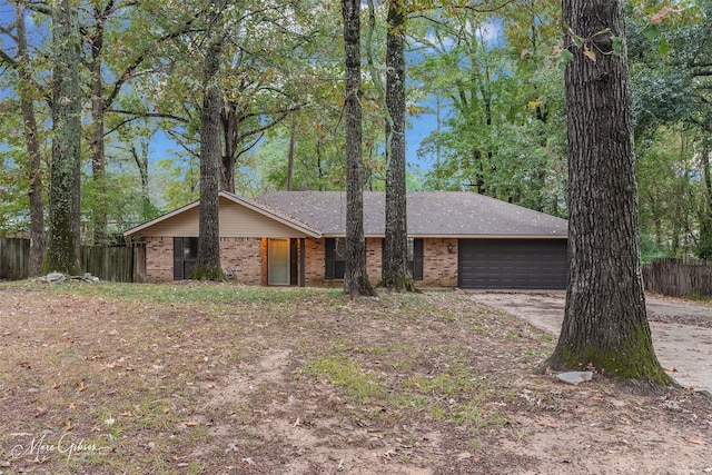 ranch-style home featuring a garage