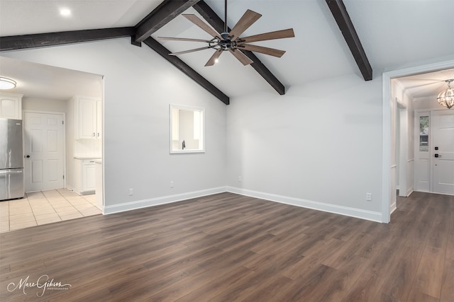 unfurnished living room with lofted ceiling with beams, light hardwood / wood-style floors, and ceiling fan with notable chandelier