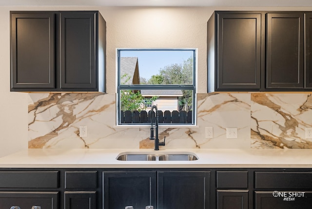 kitchen with tasteful backsplash and sink