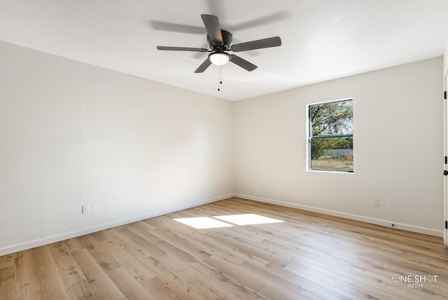 empty room featuring light hardwood / wood-style floors and ceiling fan