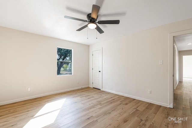 empty room featuring ceiling fan and light hardwood / wood-style flooring