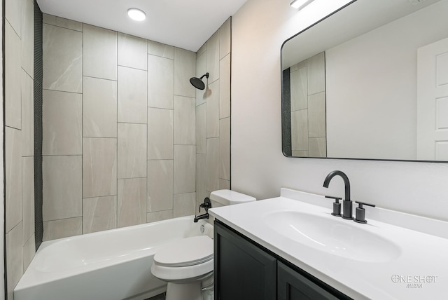 full bathroom with vanity, toilet, and tiled shower / bath