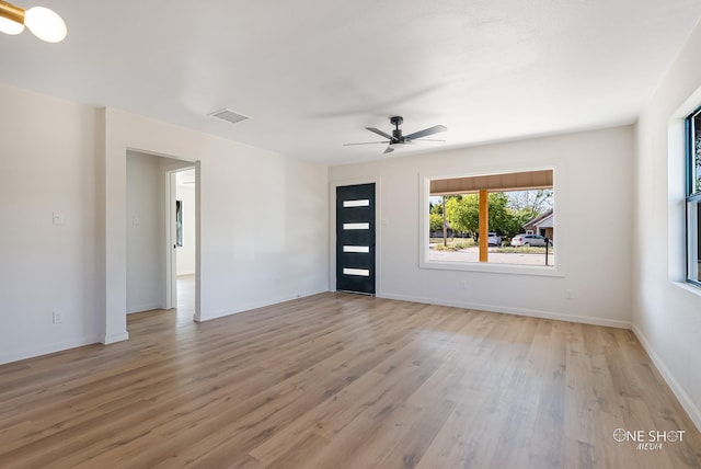 unfurnished room with light hardwood / wood-style flooring and ceiling fan