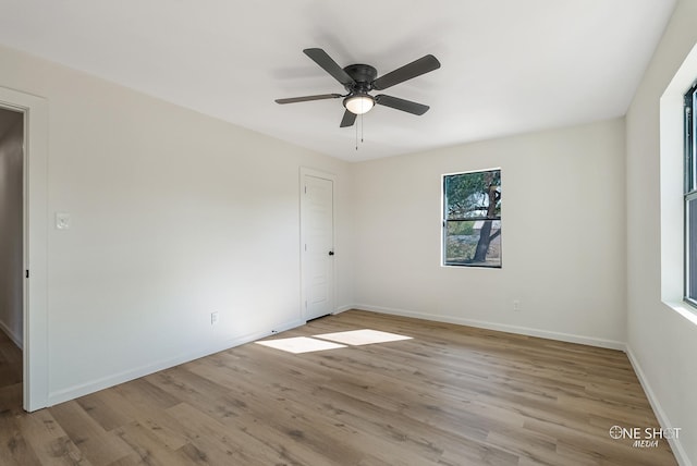 unfurnished room featuring light hardwood / wood-style floors and ceiling fan