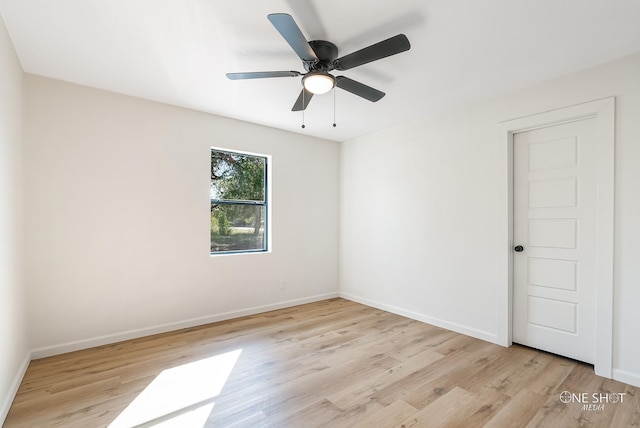 spare room featuring light hardwood / wood-style floors and ceiling fan