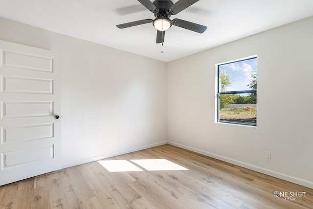 empty room featuring light hardwood / wood-style floors and ceiling fan