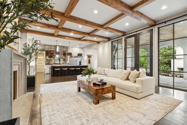 living room with hardwood / wood-style flooring, beamed ceiling, and coffered ceiling