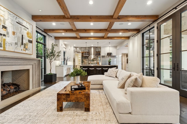 living room with french doors, beam ceiling, coffered ceiling, and wood-type flooring