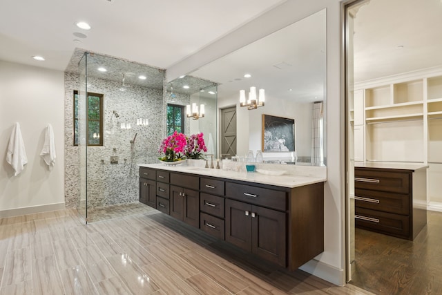 bathroom with vanity, hardwood / wood-style flooring, and walk in shower