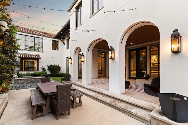 view of patio terrace at dusk