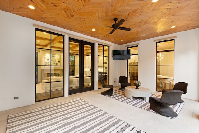 interior space featuring french doors, light tile patterned flooring, and ensuite bathroom