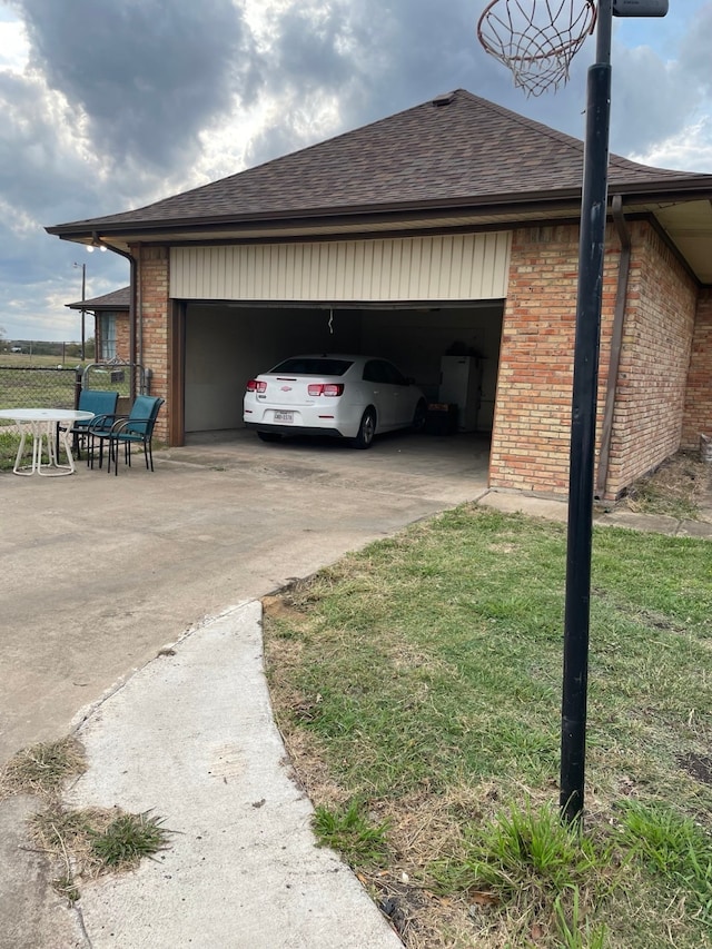 view of home's exterior featuring a garage and a yard