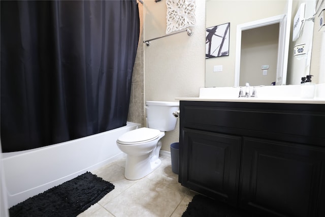 full bathroom with toilet, vanity, tile patterned floors, and shower / tub combo