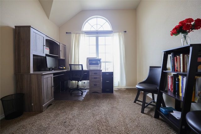 carpeted office space featuring vaulted ceiling