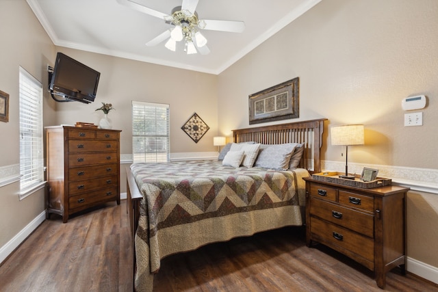 bedroom featuring dark wood-type flooring, ceiling fan, and ornamental molding