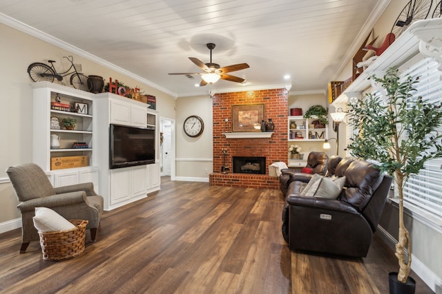 living room with ceiling fan, ornamental molding, dark hardwood / wood-style floors, and a brick fireplace