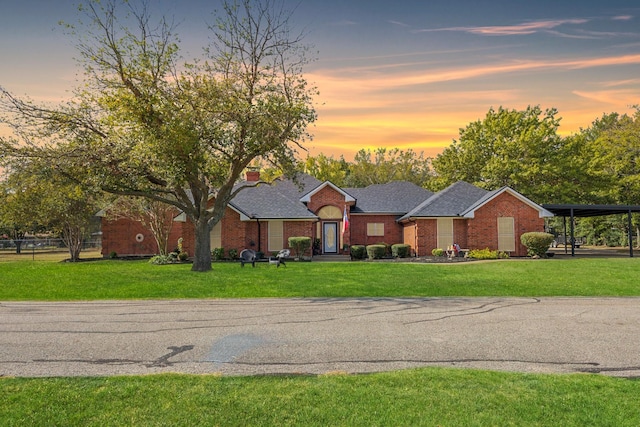 308 N Elm, Quinlan, TX 75474 - ranch-style home with brick siding, a front yard, and a carport