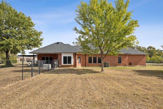 rear view of house featuring cooling unit