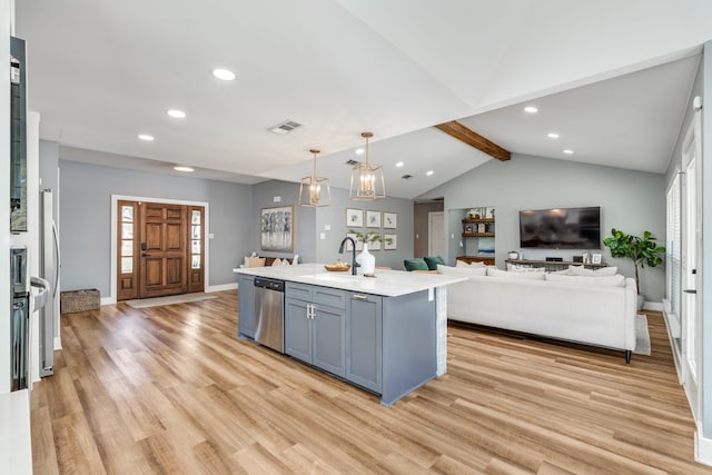 kitchen with light hardwood / wood-style flooring, a kitchen island with sink, lofted ceiling with beams, and hanging light fixtures