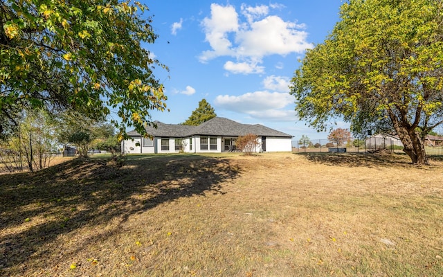 exterior space with a front lawn and a garage