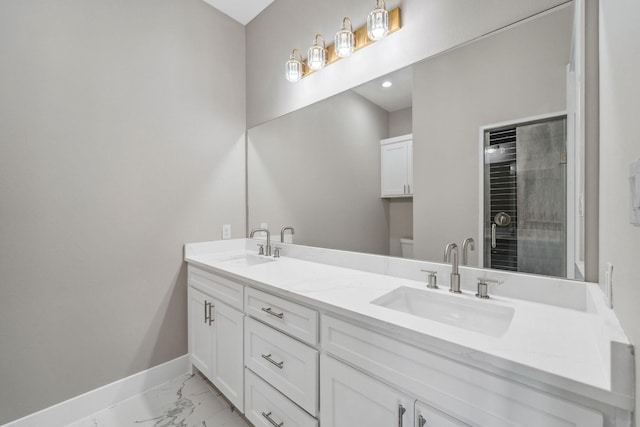 bathroom with vanity, toilet, and an enclosed shower