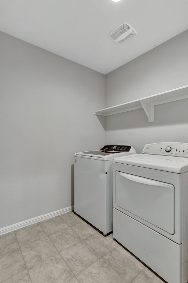 washroom featuring independent washer and dryer