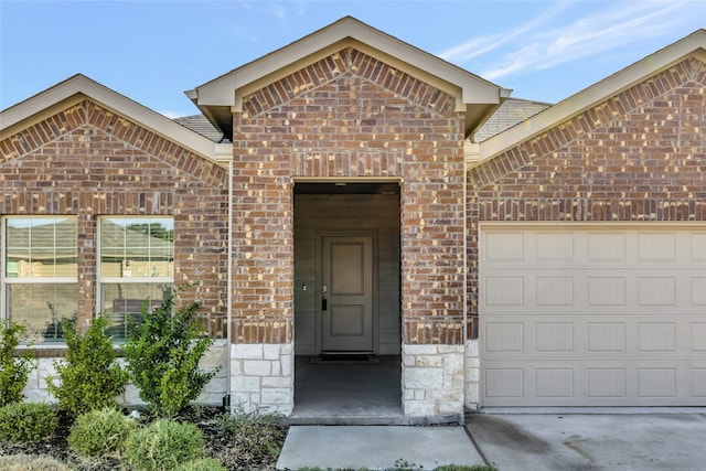 view of exterior entry featuring a garage