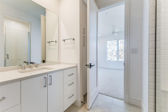 bathroom with ceiling fan and vanity