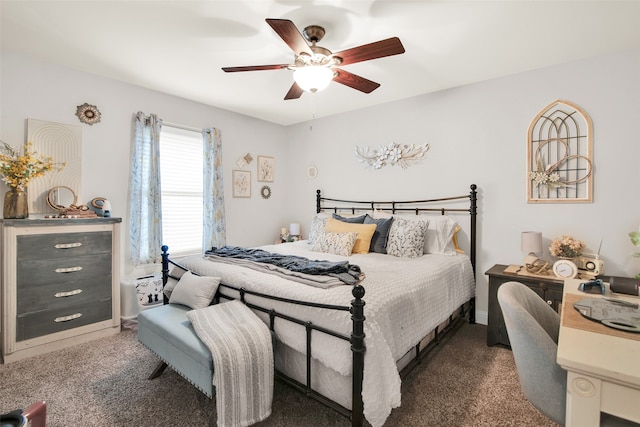 bedroom with ceiling fan and dark carpet