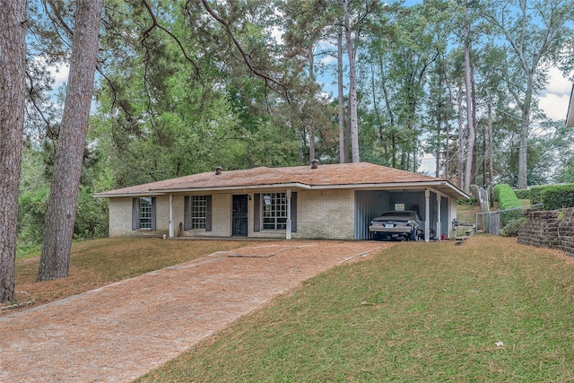 ranch-style home featuring a front yard and a carport