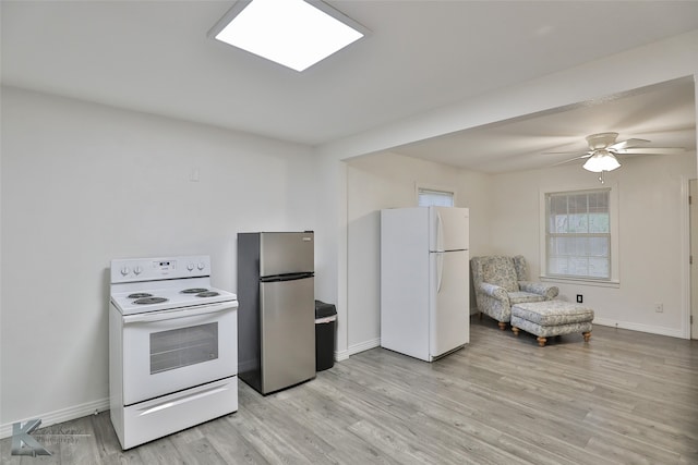 kitchen with light hardwood / wood-style floors, white appliances, and ceiling fan